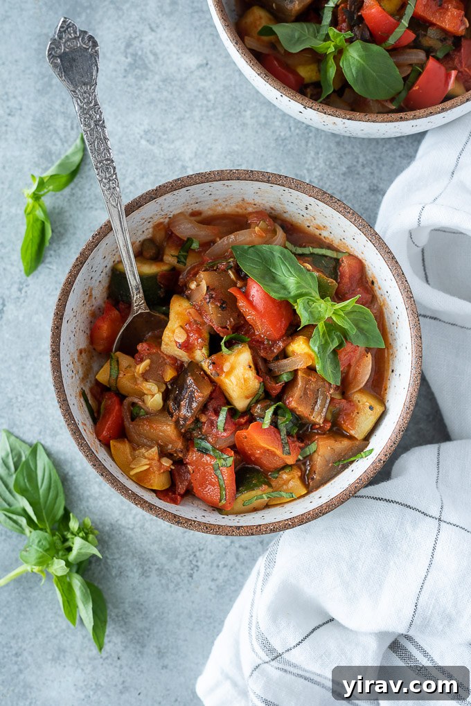 Effortless Ratatouille 3 A rustic bowl of ratatouille with a wooden spoon, ready to be enjoyed