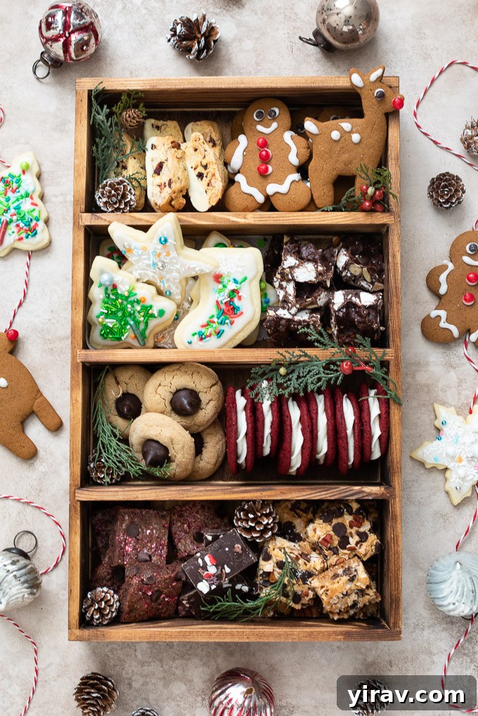A beautifully arranged cookie gift box filled with an assortment of holiday cookies, delicate biscotti, and irresistible rocky road candy