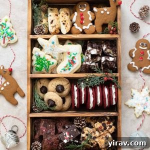 Christmas cookie box with twine, pine cones and ornament decorations