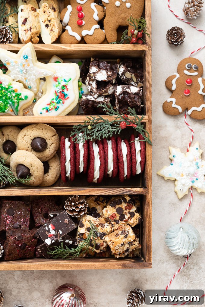 A festive Christmas cookie box brimming with a variety of cookies, candies, and holiday decorations, ready for gifting