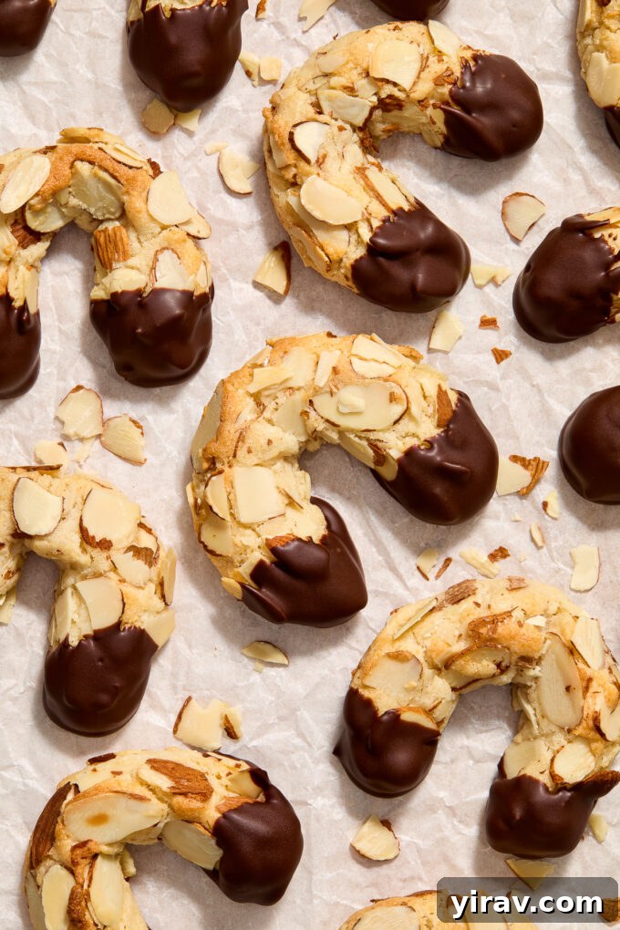 Almond horn cookies on parchment paper.