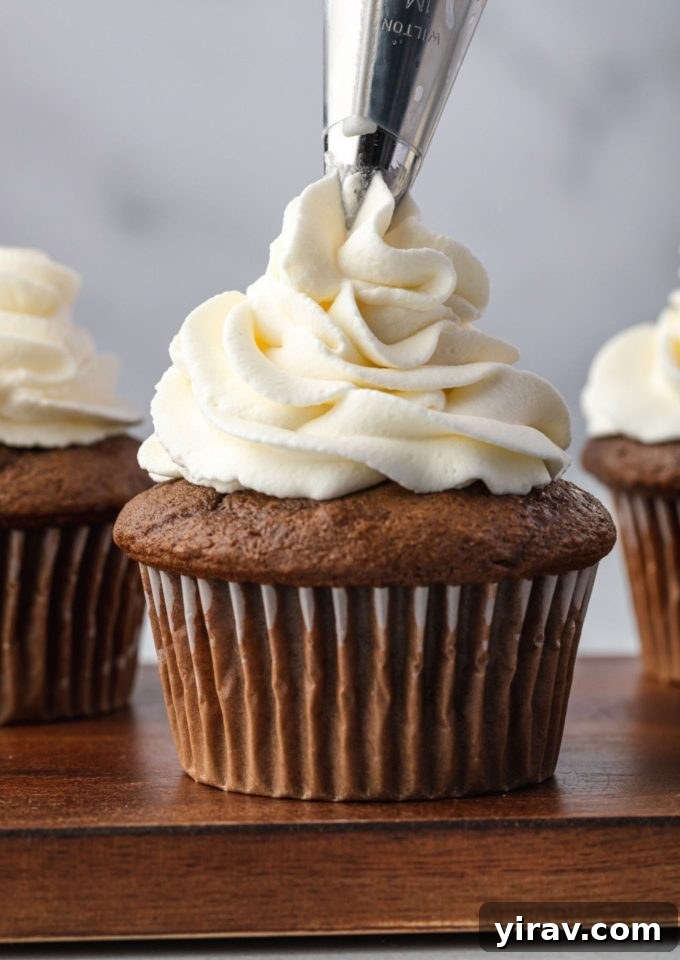 Foolproof Whipped Cream 2 Stabilized whipped cream piped onto a cupcake, holding its shape perfectly