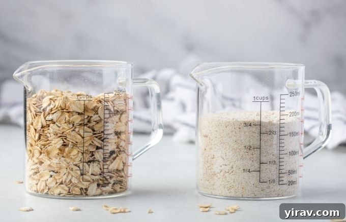 Homemade Oat Flour: Simple & Quick 5 A measuring cup filled with 1 cup of rolled oats next to another measuring cup containing 3/4 cup of homemade oat flour, demonstrating the conversion.