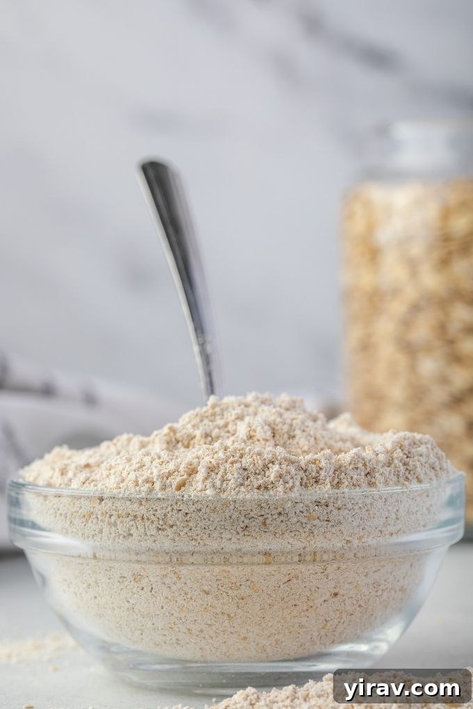 Homemade Oat Flour: Simple & Quick 8 Homemade oat flour in a rustic bowl with a large wooden spoon, ready for use in delicious recipes.