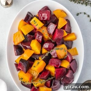 Roasted beets on a platter with thyme sprigs
