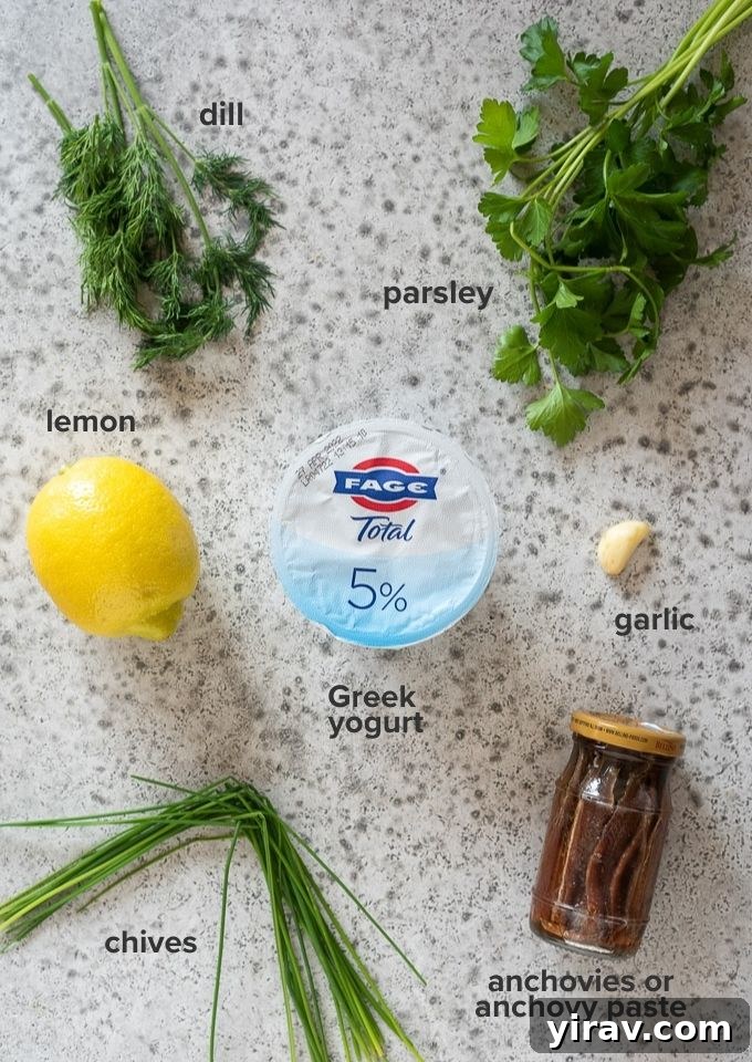 The Perfect Green Goddess Dressing 4 Various fresh ingredients for Green Goddess dressing, including Greek yogurt, herbs, and lemon.