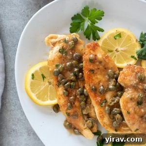 Deliciously Simple Chicken Piccata 10 Chicken piccata on a serving plate