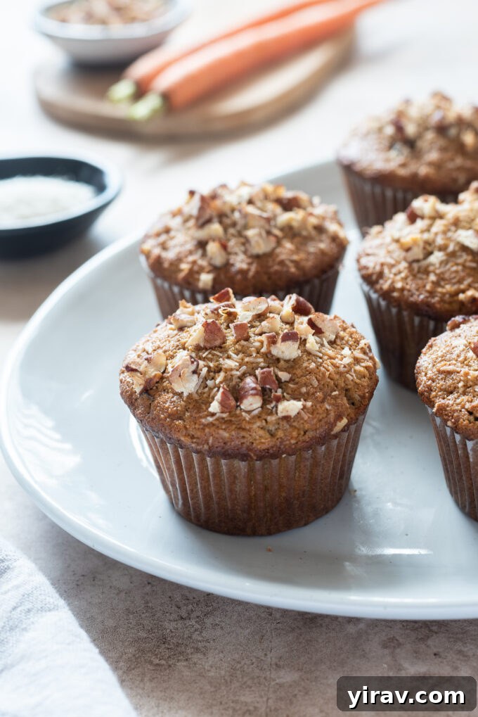 Beautifully arranged gluten-free morning glory muffins on a rustic platter, showcasing their wholesome ingredients and golden-brown tops.
