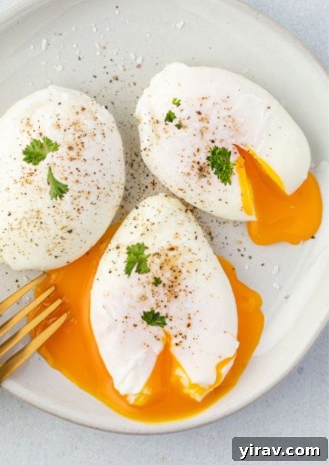 Poached eggs on a plate with parsley and runny yolks