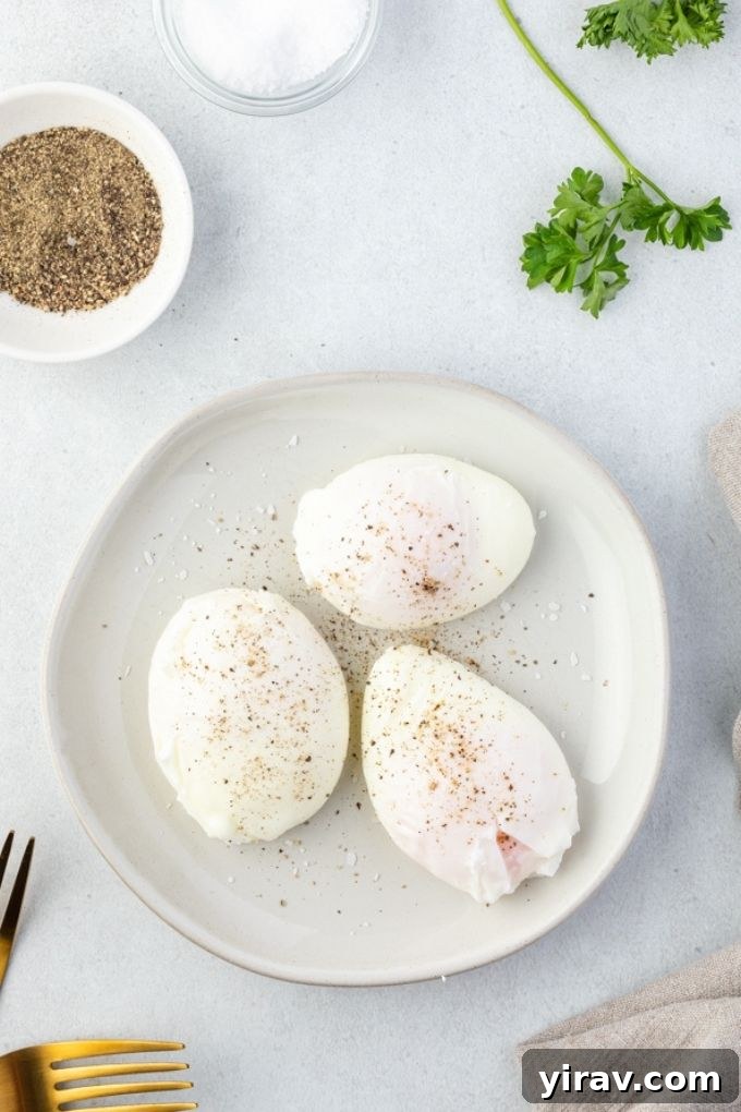 Poached eggs on a plate with pepper