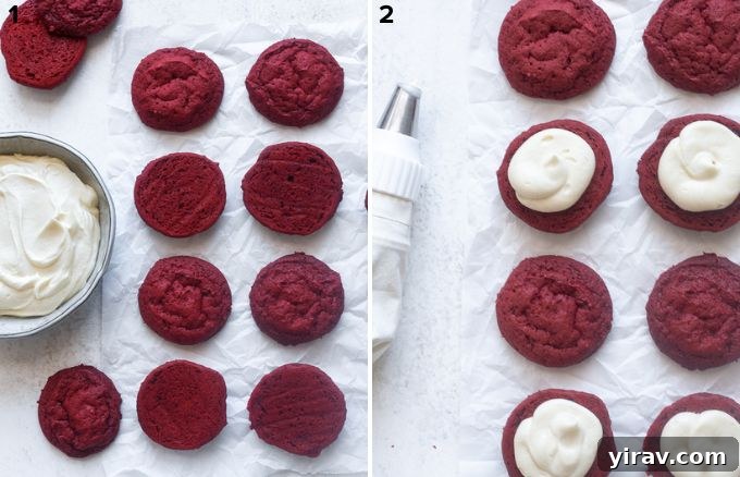 Close-up view of a red velvet whoopie pie being assembled with cream cheese frosting.