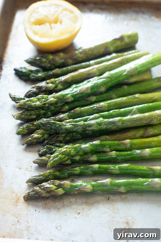 Perfectly Roasted Asparagus 6 Oven roasted asparagus on a sheet pan with lemon