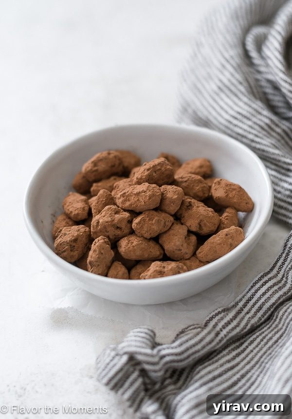 Sugar-Coated Almonds 6 Close up of almond dragees in a white bowl with a linen