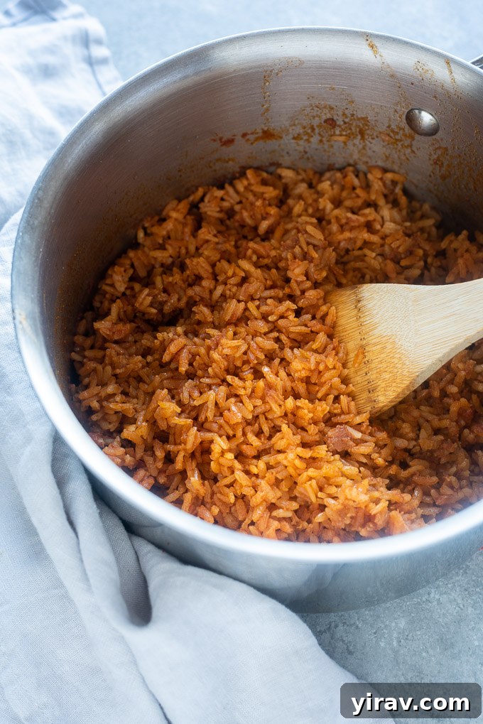 Easy Mexican rice cooking in a saucepan on the stovetop