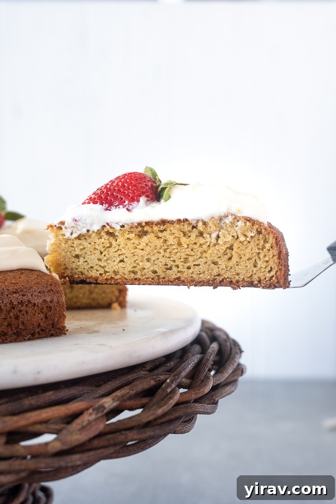 Pure Almond Bliss 7 Cake server lifting a slice of almond flour lemon cake