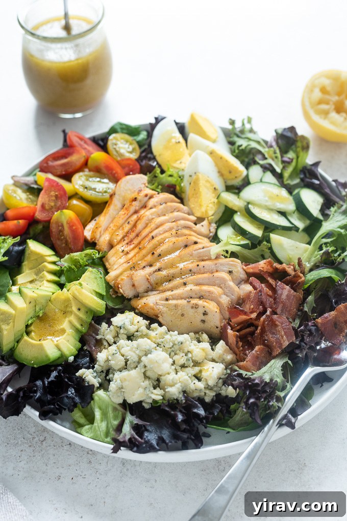 Ultimate Chicken Cobb Salad 3 Cobb salad with chicken in a white bowl