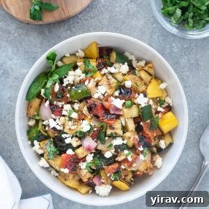 A close-up of a serving of Grilled Vegetable Salad in a bowl, perfect for a summer meal.
