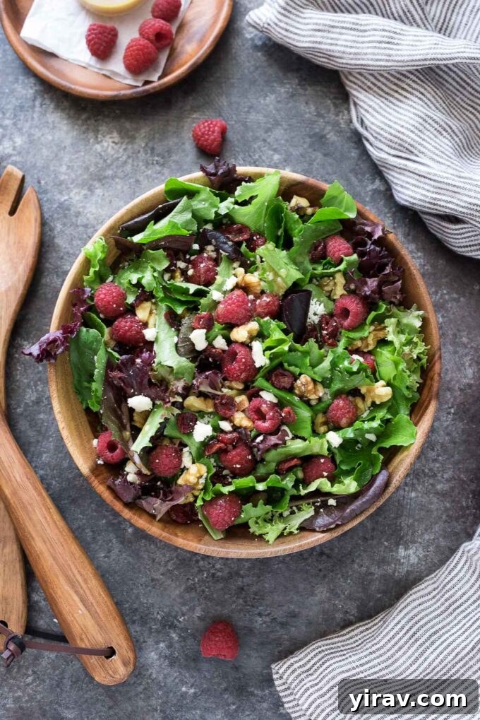 30 Refreshing Summer Salad Ideas 12 A vibrant Raspberry Salad presented in a beautiful serving bowl.