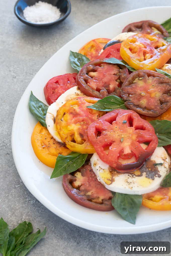 Simple Caprese Perfection 7 Tomato mozzarella salad with balsamic vinegar and olive oil drizzled over the top