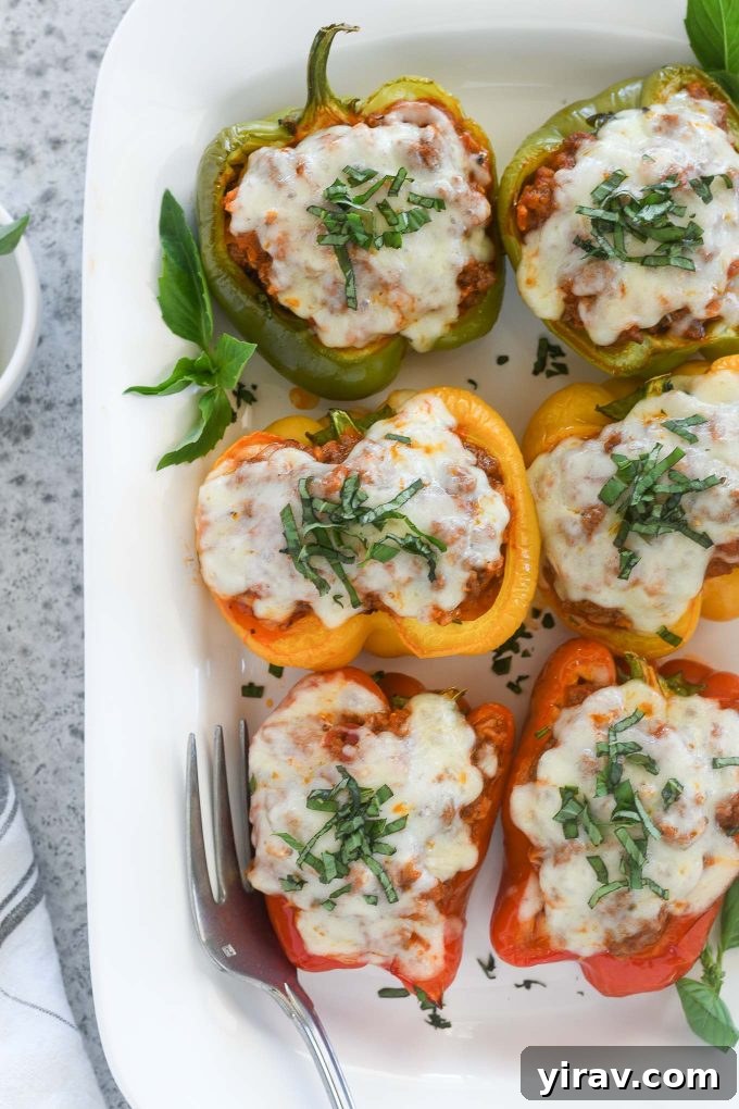 Italian stuffed peppers on a white serving platter