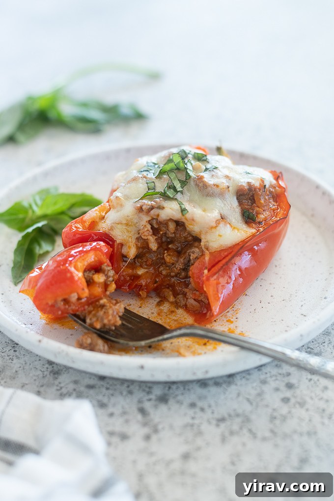 Fork cutting into a stuffed bell pepper