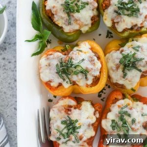 Italian stuffed peppers on a white serving platter