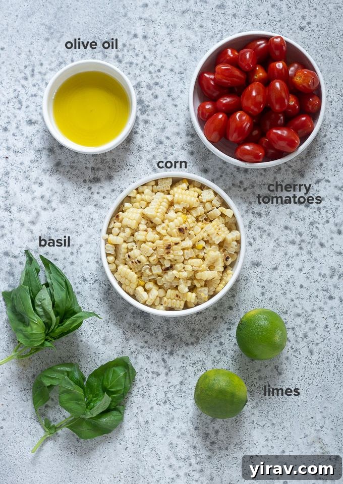Vibrant Summer Corn and Tomato Medley 4 Fresh corn, cherry tomatoes, basil, lime, and olive oil laid out as ingredients for the salad recipe