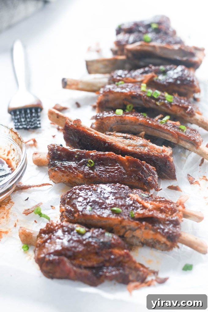 Instant Pot ribs with bbq sauce and scallions, garnished and ready to serve.