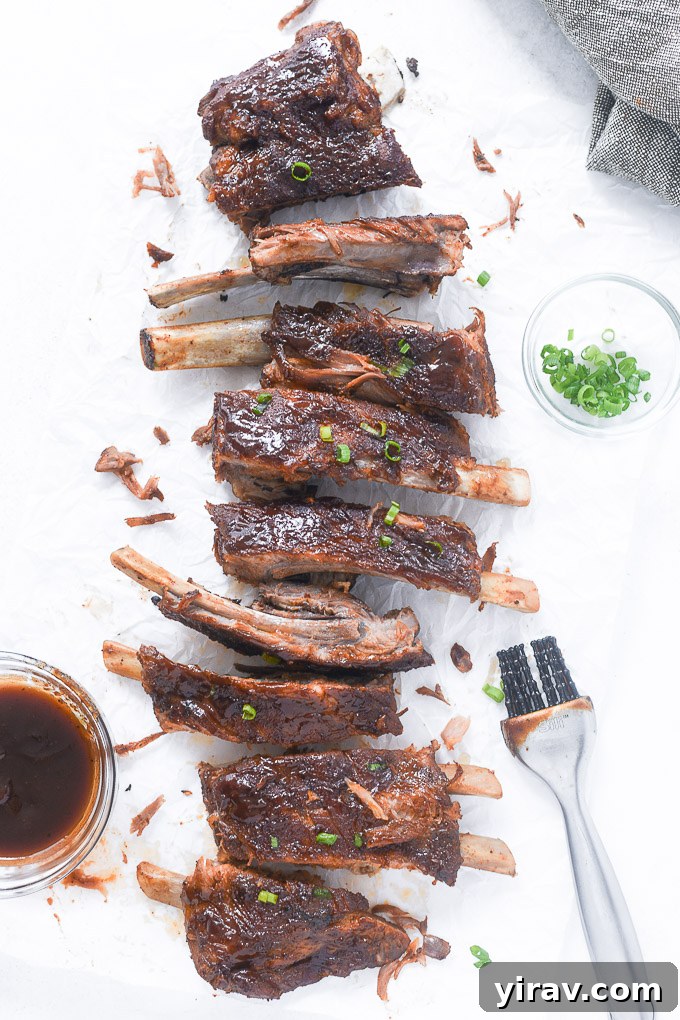 Perfectly cut Instant Pot spare ribs on parchment paper, ready to be served.