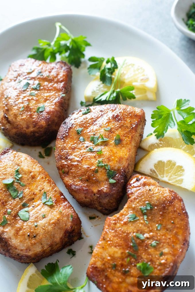 Air Fryer Magic: 15+ Effortless Meals 12 Air fryer pork chops on a platter