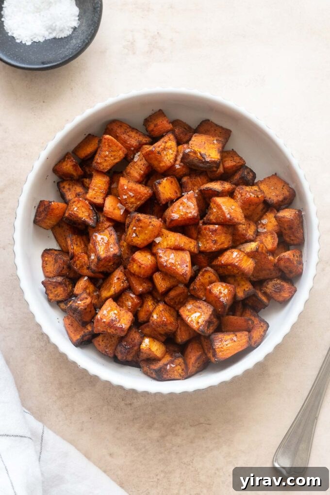 Air Fryer Magic: 15+ Effortless Meals 22 Air fryer roasted sweet potatoes in a white bowl.
