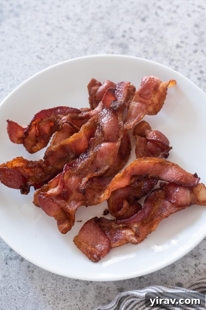 Air Fryer Magic: 15+ Effortless Meals 9 Air fryer bacon on a white plate