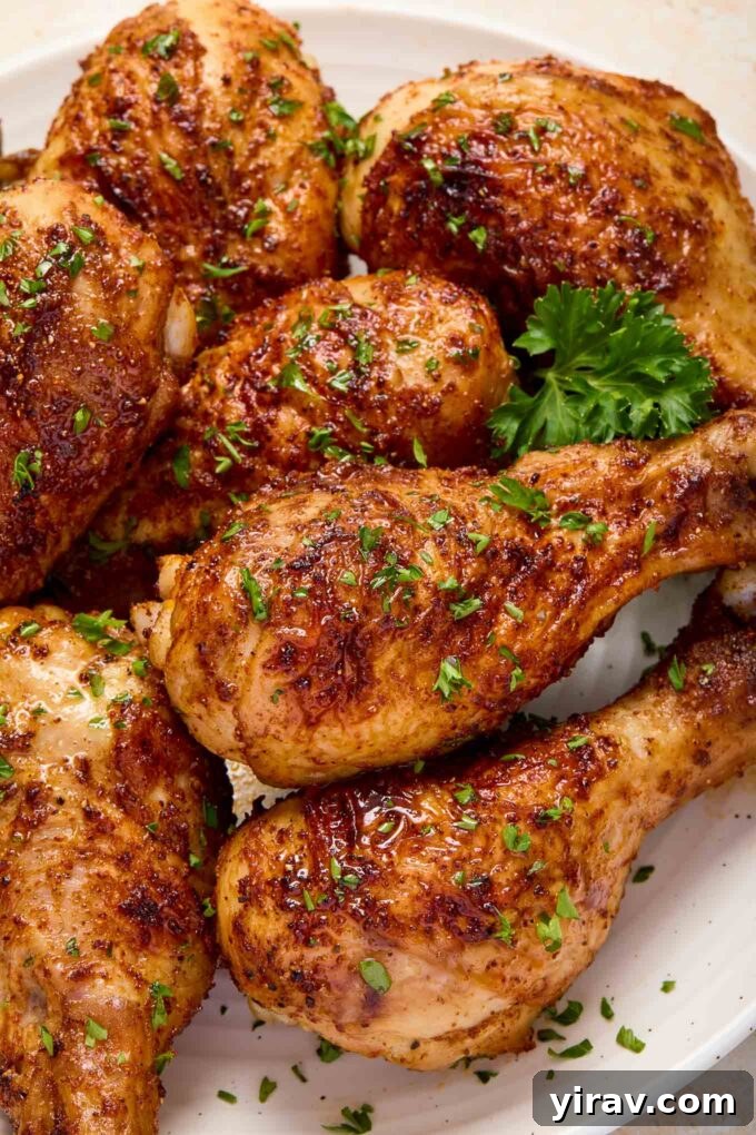 Air Fryer Magic: 15+ Effortless Meals 5 Air fryer chicken drumsticks on a plate with parsley