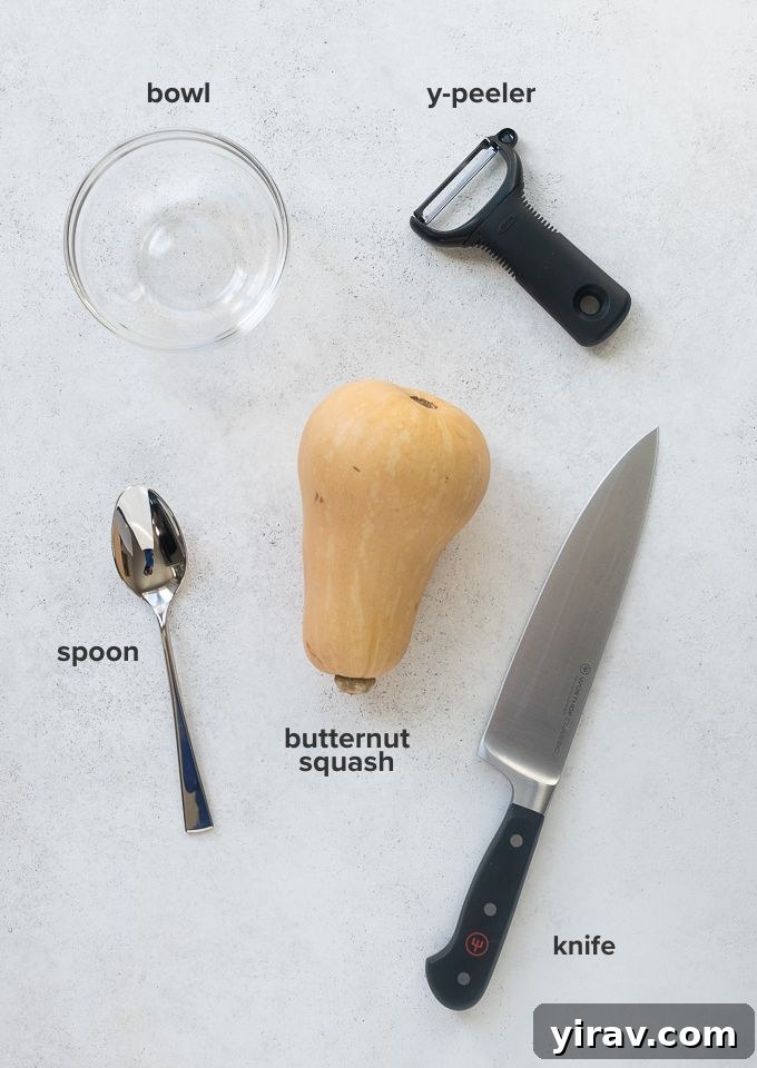 Effortless Butternut Squash Preparation 4 Selection of kitchen tools: a butternut squash, a large knife, a Y-peeler, a spoon, and a large cutting board.