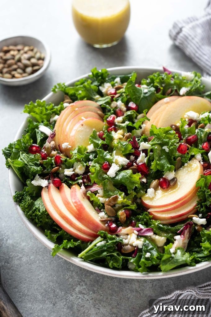 Kale Apple Salad with pomegranate and pepitas, a perfect representation of fall flavors.
