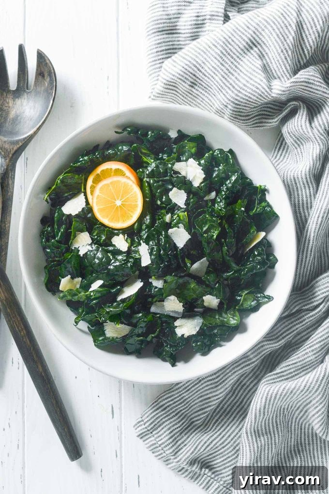 Massaged Kale Salad with shaved parmesan and lemon wedges.