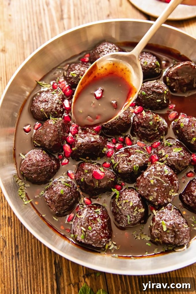 Delicious Sweet and Sour Meatballs in Pomegranate Sauce, featuring the rich flavors of Central Asia.