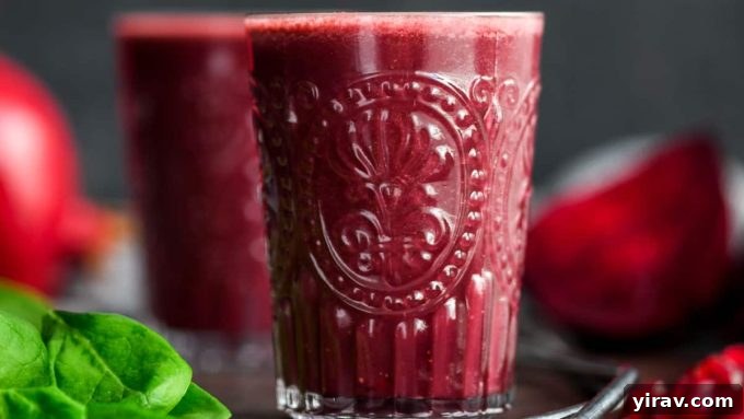 A vibrant Beet & Pomegranate Smoothie with Spinach, showcasing a healthy and colorful blend.
