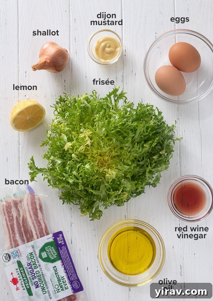 Ingredients for Salade Lyonnaise laid out on a wooden board, including frisée lettuce, bacon, eggs, shallots, and various dressing components.