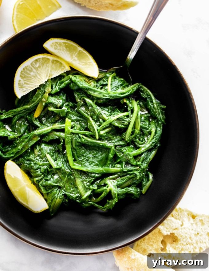 Platter of Horta Vrasta (Greek Boiled Leafy Greens) dressed with olive oil and lemon