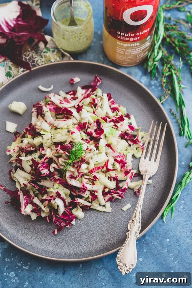 Radicchio Endive Salad with Fennel and Tangy Dijon Herb Dressing in a serving bowl