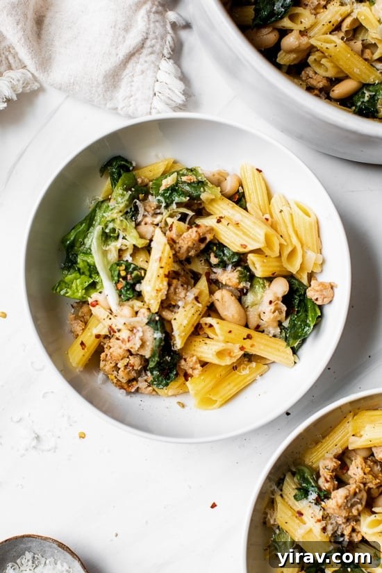 Hearty pasta dish with Italian chicken sausage, escarole, and beans