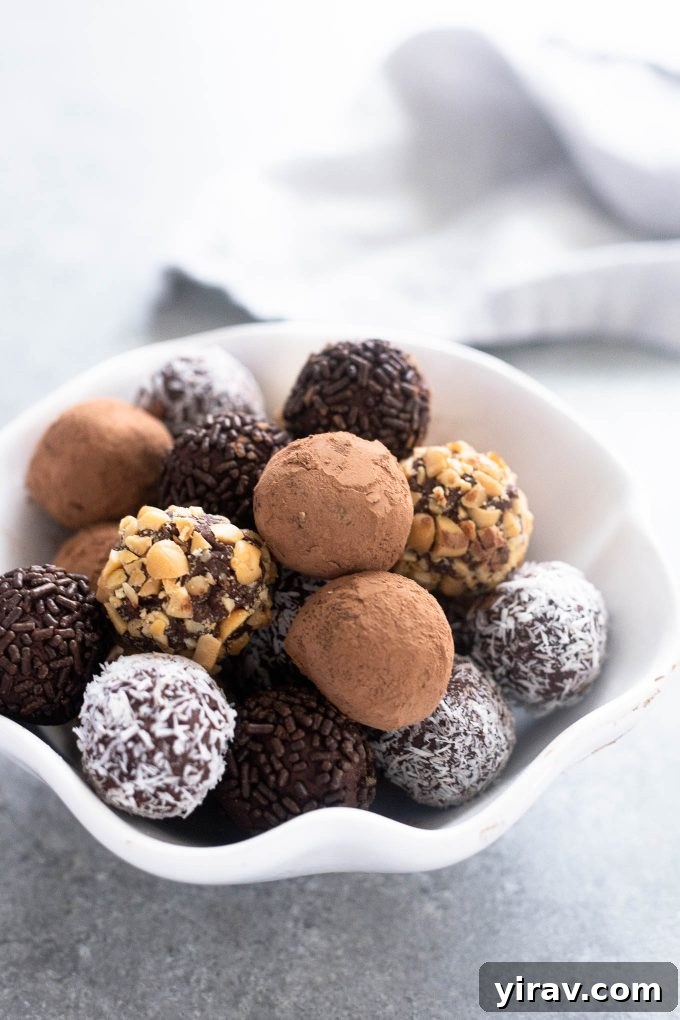 Decadent chocolate truffles artfully arranged in a pristine white bowl, ready to be enjoyed.