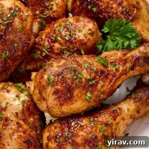 Air fryer chicken drumsticks on a plate with parsley