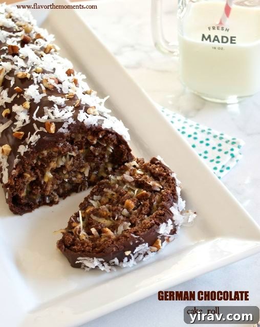Slice of German chocolate roll cake on white platter