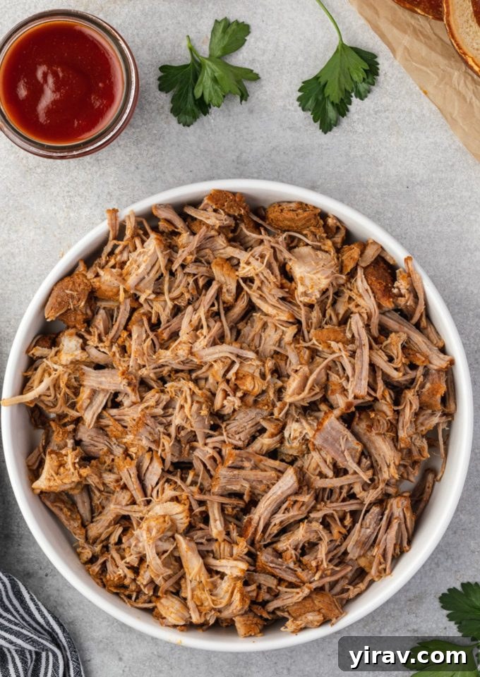 25+ Effortless Instant Pot Meals 21 Instant pot pulled pork in a white bowl