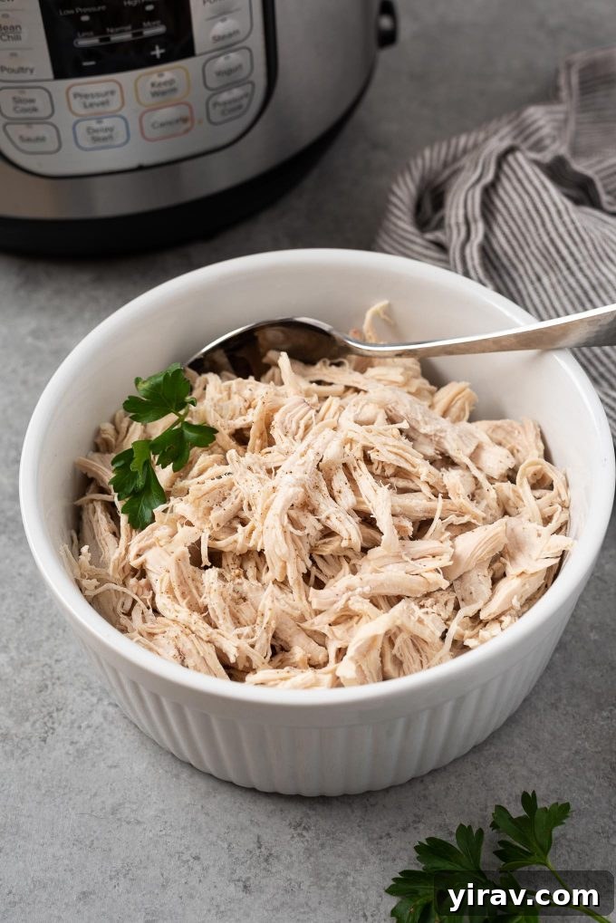 25+ Effortless Instant Pot Meals 25 Instant Pot shredded chicken in a white dish with parsley