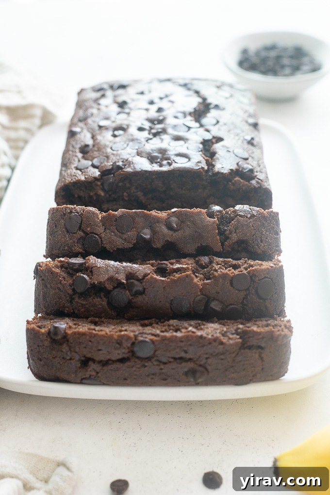 Healthy chocolate banana bread sliced on a platter ready to serve