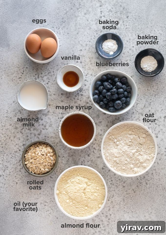 Rustic Blueberry Oat Muffins 4 A flat lay photograph showcasing all the individual ingredients needed to make blueberry oatmeal muffins, neatly arranged.
