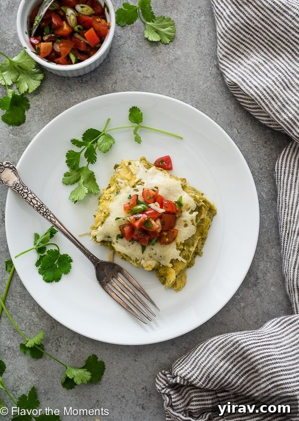 Cheesy Chicken Enchilada Bake 7 Chicken Verde Enchilada Bake on plate with salsa, overhead shot